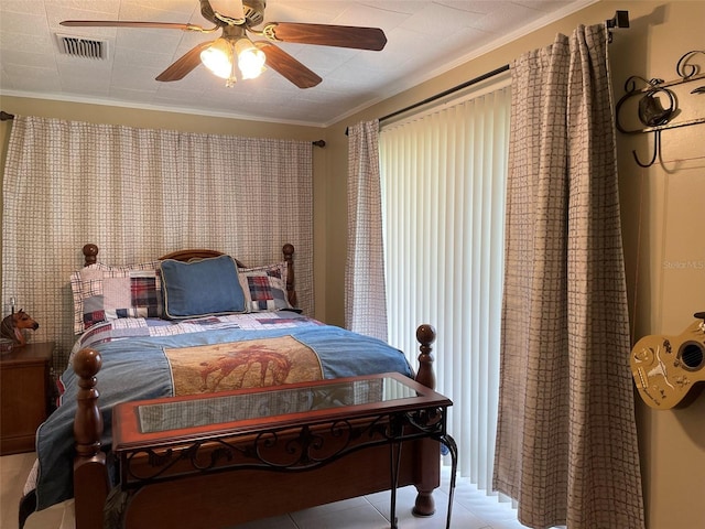 tiled bedroom featuring crown molding and ceiling fan