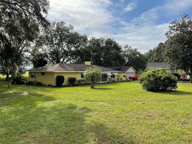 view of yard featuring a garage