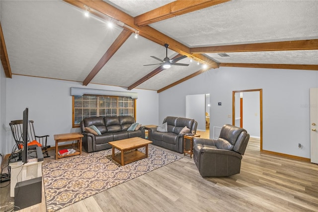 living room featuring light wood-type flooring, lofted ceiling with beams, a textured ceiling, and ceiling fan