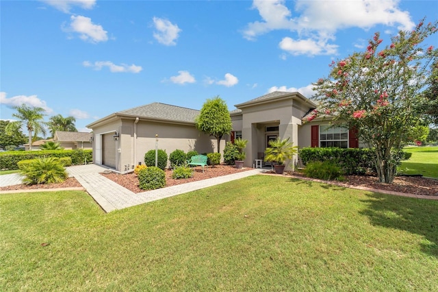 view of front of home with a garage and a front lawn