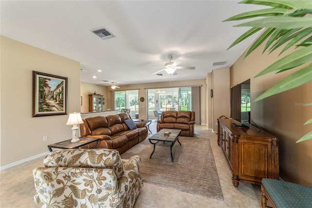 tiled living room featuring ceiling fan