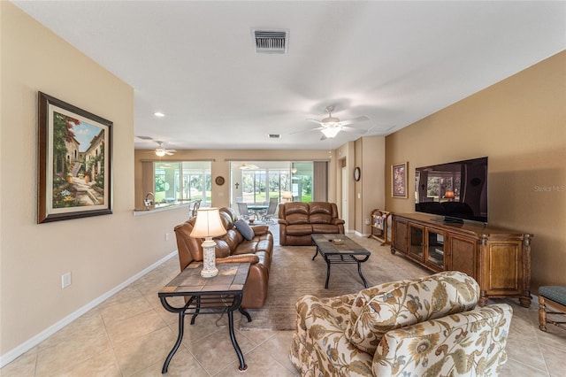 tiled living room with ceiling fan