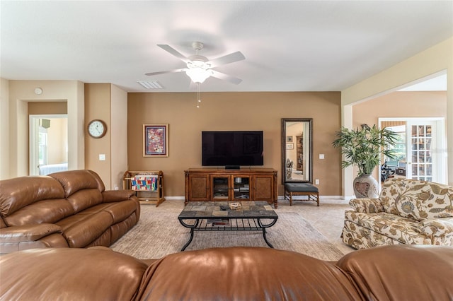 living room featuring ceiling fan and light tile patterned floors