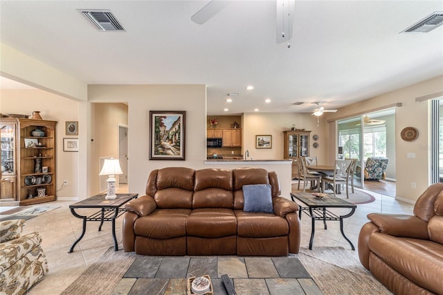 living room featuring ceiling fan