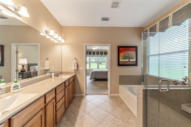 bathroom with tile patterned floors, ceiling fan, shower with separate bathtub, and vanity