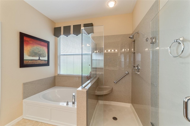 bathroom featuring shower with separate bathtub