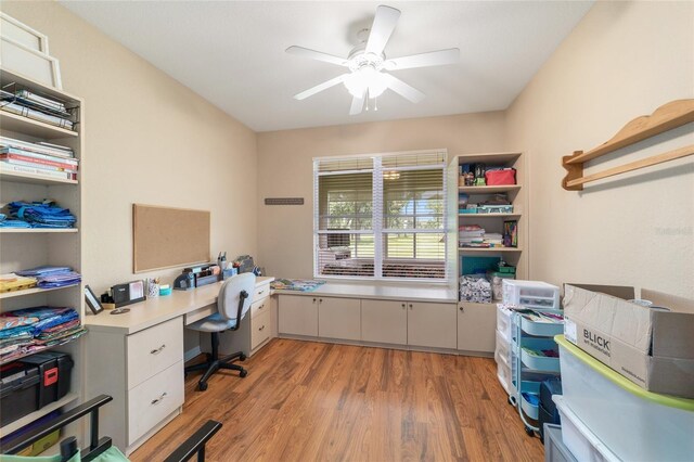 office space with ceiling fan and light hardwood / wood-style floors