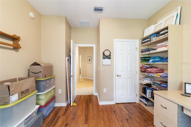 office with dark hardwood / wood-style flooring