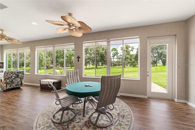 sunroom featuring ceiling fan