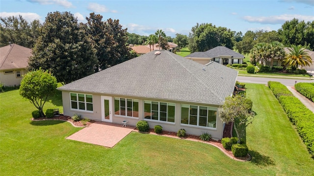 back of house featuring a lawn