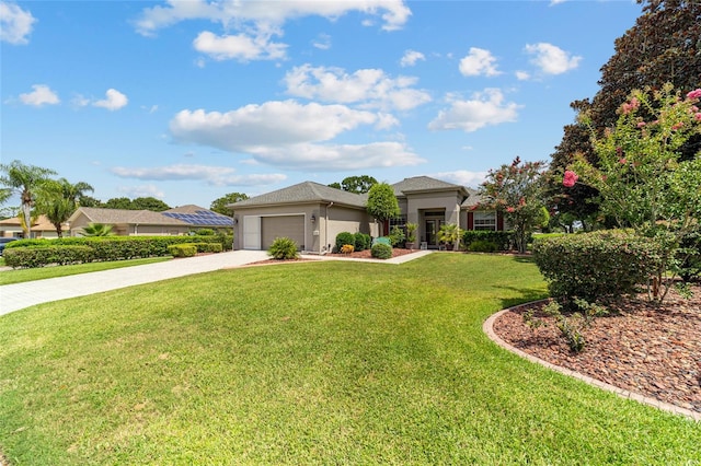 view of front of home with a garage and a front yard