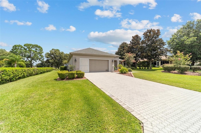 view of front of home featuring a garage and a front yard