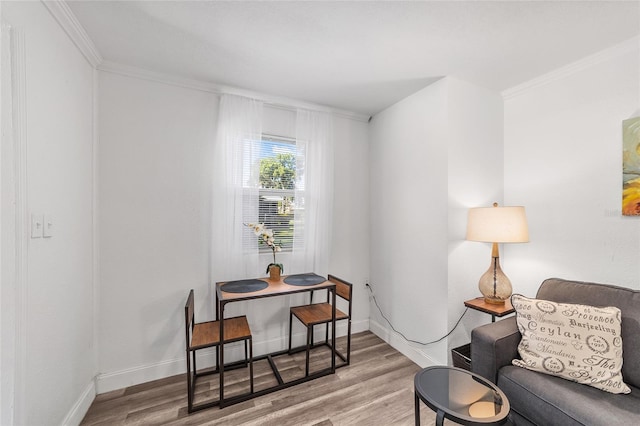 interior space with light hardwood / wood-style flooring and crown molding