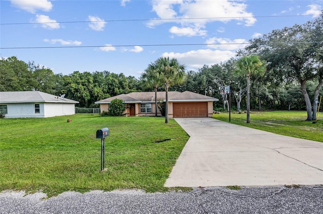 single story home with a garage and a front lawn