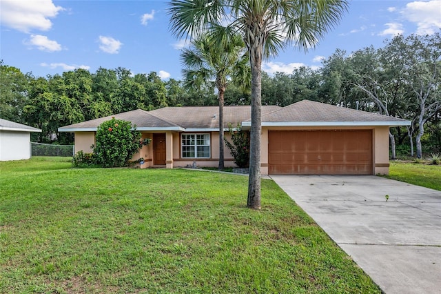 ranch-style home featuring a garage, stucco siding, a front lawn, and driveway