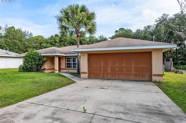 ranch-style home featuring a garage and a front lawn