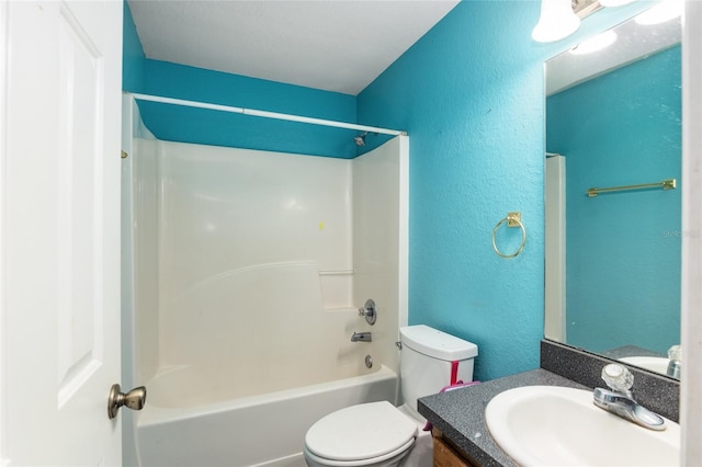 full bathroom with vanity, tub / shower combination, and toilet