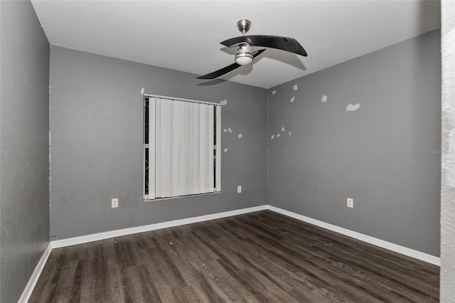 empty room with ceiling fan and hardwood / wood-style floors