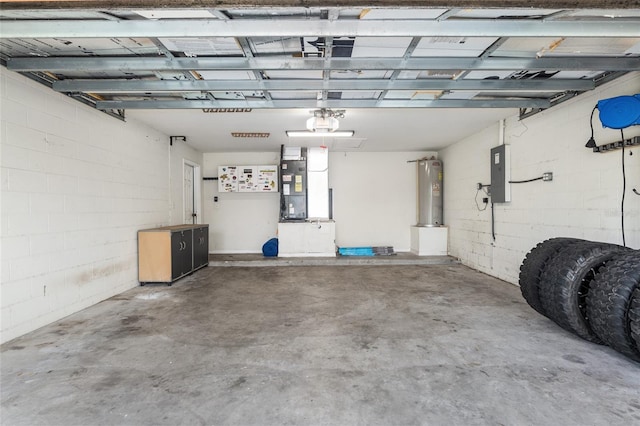 garage with heating unit, electric water heater, and electric panel