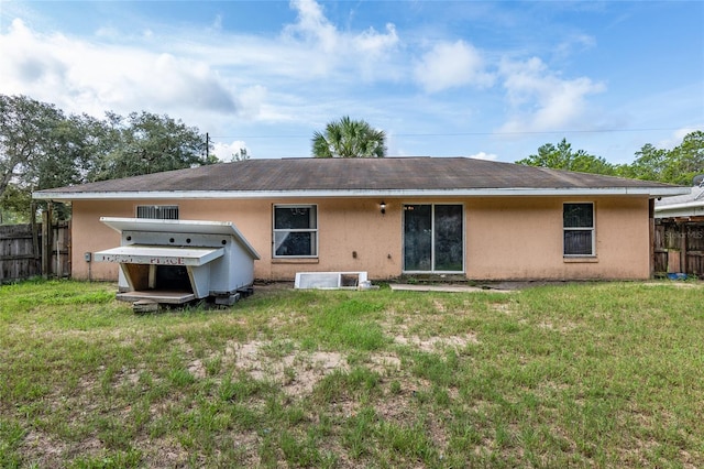 back of house with a yard