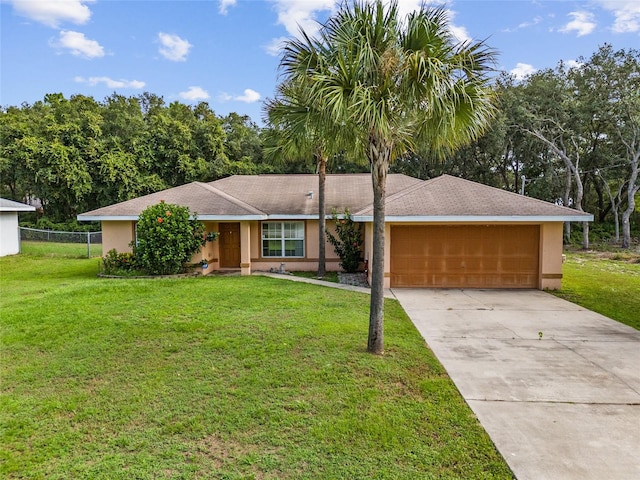 single story home featuring a garage and a front lawn