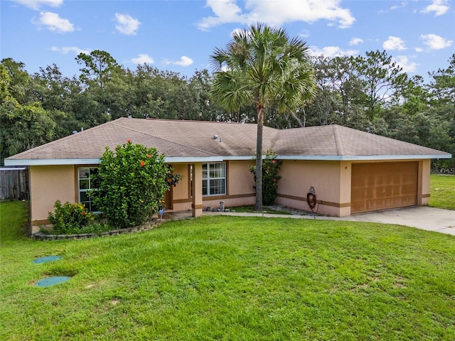 ranch-style house featuring a garage and a front lawn