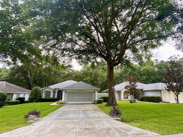 ranch-style house with a garage and a front yard