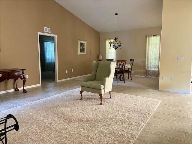 9288 SW 192nd Court Rd, Dunnellon, FL 34432 - sitting room featuring a chandelier, high vaulted ceiling, visible vents, and baseboards