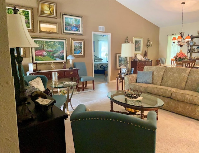 living room featuring a wealth of natural light, vaulted ceiling, and a notable chandelier