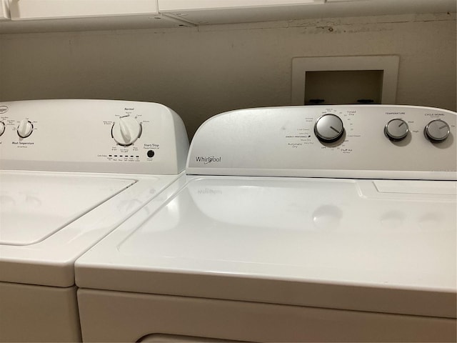 clothes washing area featuring washing machine and dryer