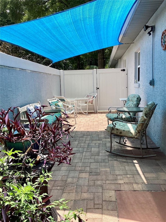9288 SW 192nd Court Rd, Dunnellon, FL 34432 - view of patio / terrace featuring fence