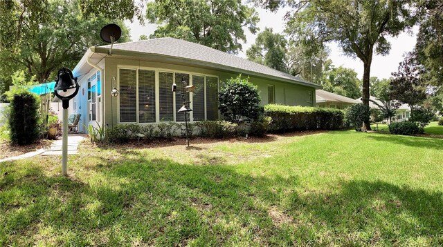 rear view of house with a lawn