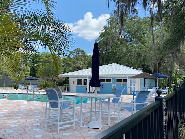 9288 SW 192nd Court Rd, Dunnellon, FL 34432 - pool with fence and a patio