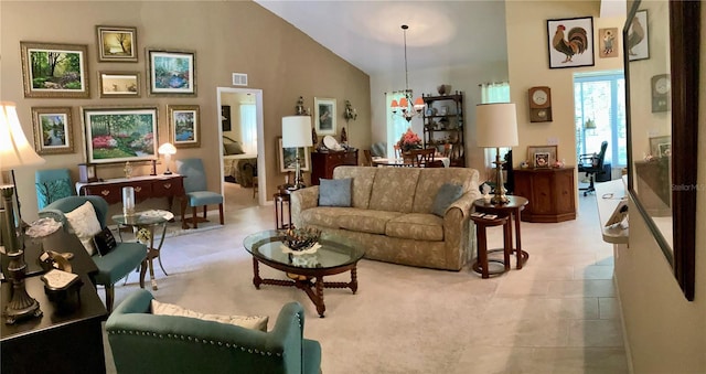 living room with high vaulted ceiling and light tile patterned floors