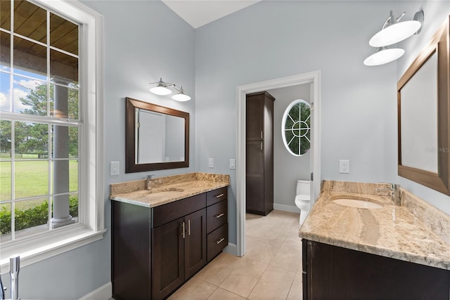 bathroom with vanity, tile patterned floors, and toilet