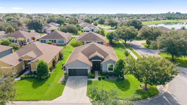 birds eye view of property with a water view