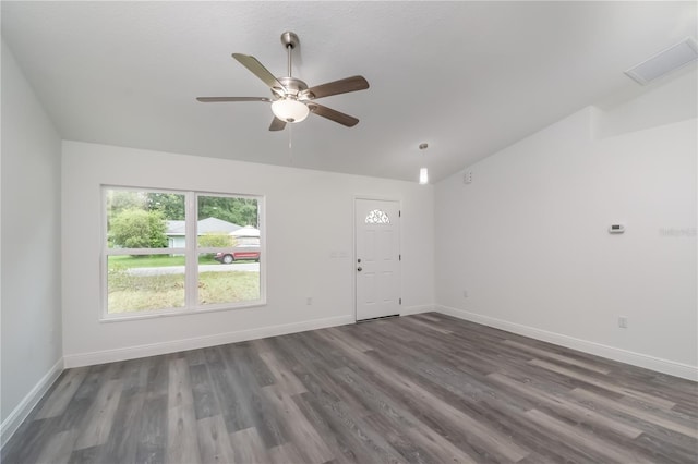 unfurnished living room featuring vaulted ceiling, ceiling fan, dark wood finished floors, and baseboards