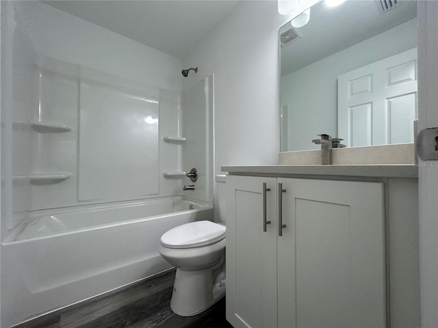 full bathroom with shower / tub combination, toilet, hardwood / wood-style floors, and vanity