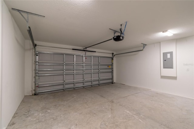 garage with electric panel and a garage door opener