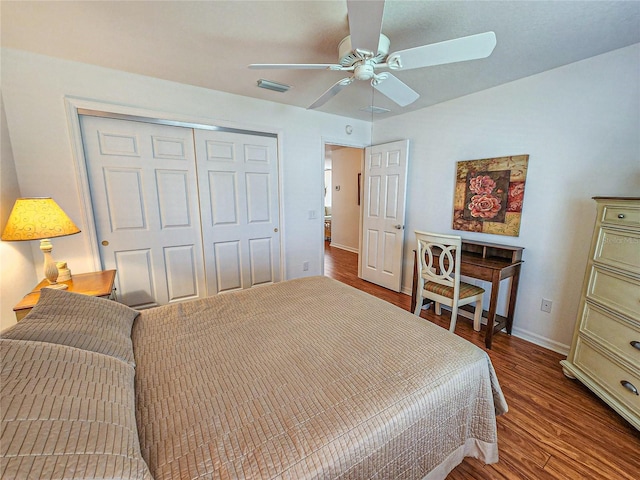 bedroom featuring hardwood / wood-style flooring, a closet, and ceiling fan