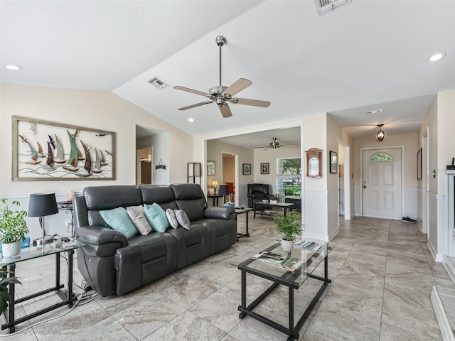 living room featuring ceiling fan and lofted ceiling