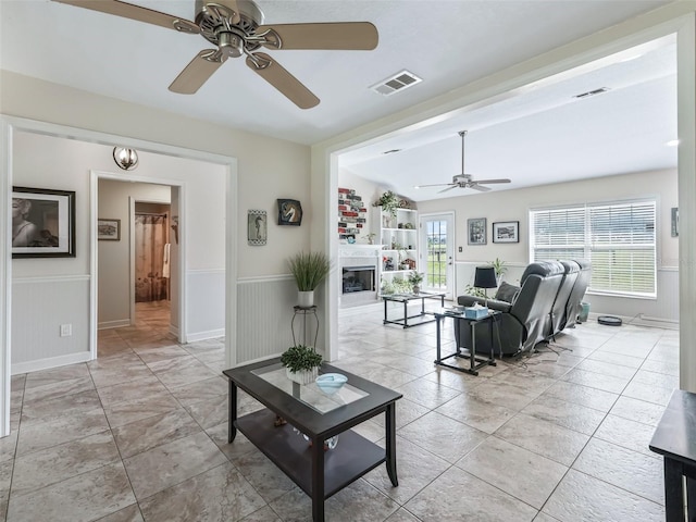 living room with lofted ceiling and ceiling fan