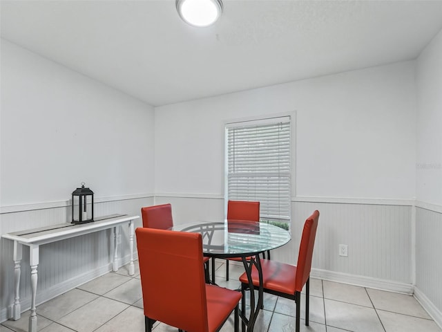 dining space with light tile patterned flooring