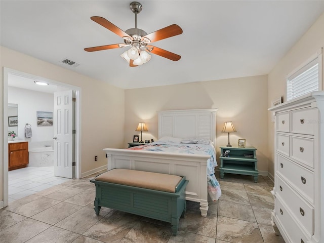 bedroom featuring ceiling fan and ensuite bath