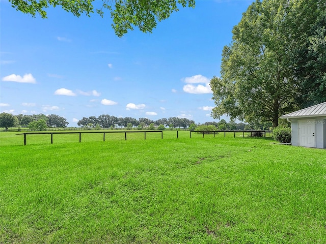 view of yard with a rural view