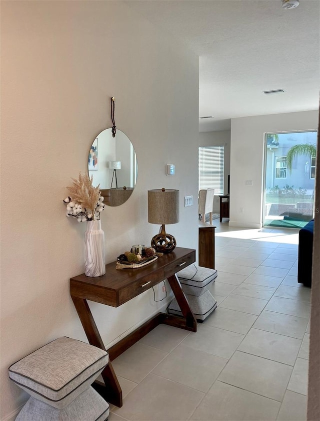 hallway with tile patterned flooring