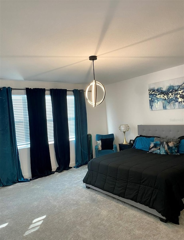 carpeted bedroom featuring multiple windows