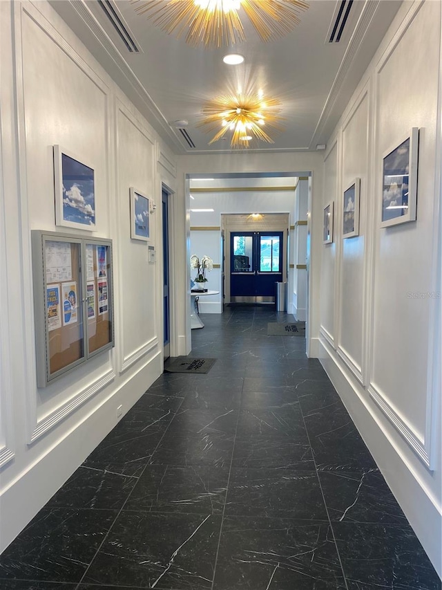 hall featuring dark tile patterned floors