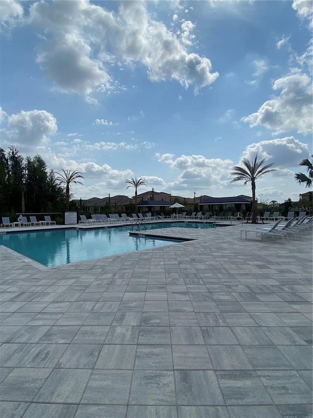 view of swimming pool with a patio area