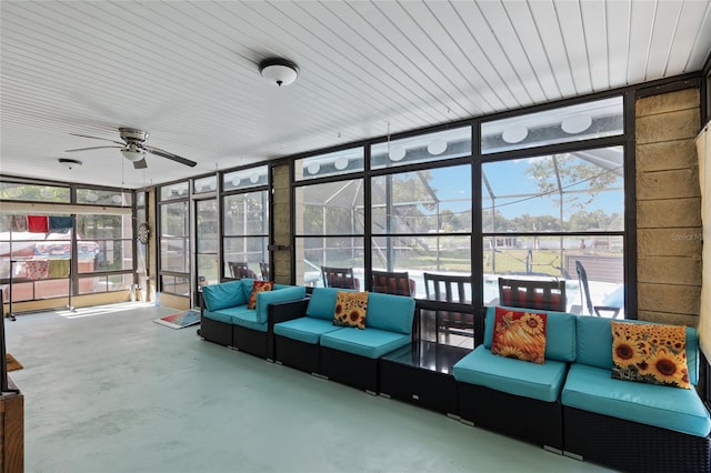 sunroom / solarium with ceiling fan and wood ceiling